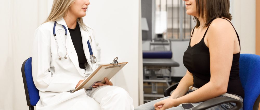 A doctor consulting a female patient