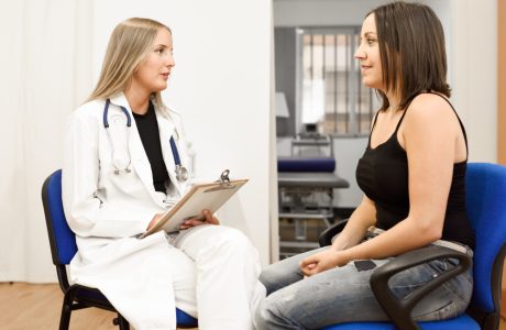 A doctor consulting a female patient