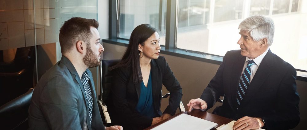 A lawyer and a couple in a meeting